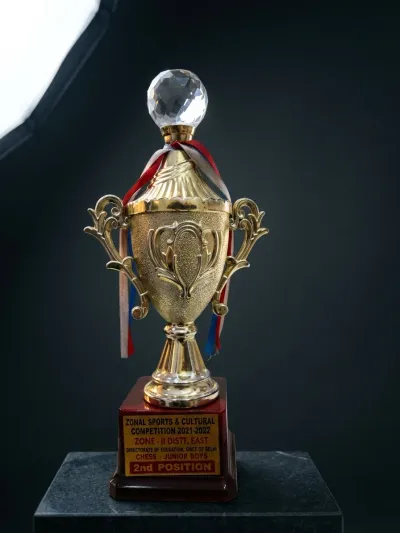 Gold trophy on red base, Zonal Sports & Cultural Competition 2021-22 Chess Junior Boys 2nd Position