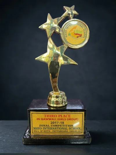 Gold star trophy with school medallion, Third Place Qawwali Girls Group 2017-18