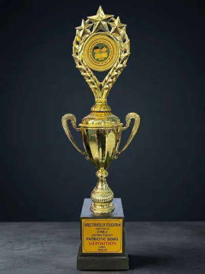 Gold trophy with Department of Education medallion, Patriotic Song Girls 3rd Position 2023-24
